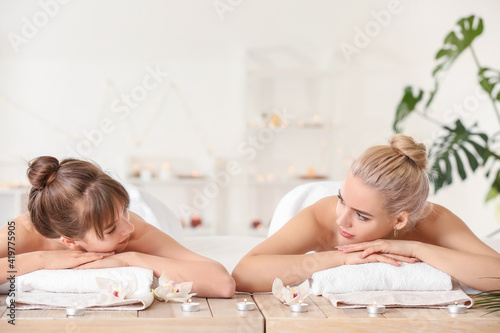 Lesbian couple relaxing in ...