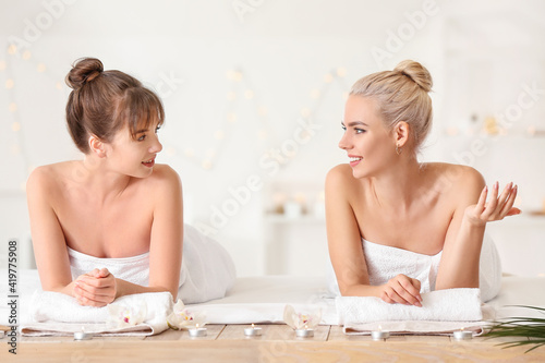Lesbian couple relaxing in ...
