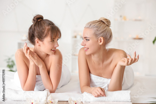 Lesbian couple relaxing in ...
