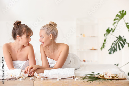 Lesbian couple relaxing in ...