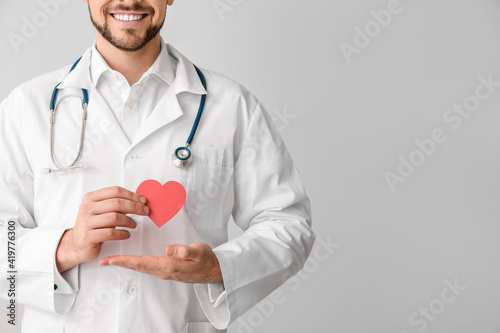 Cardiologist with red heart...
