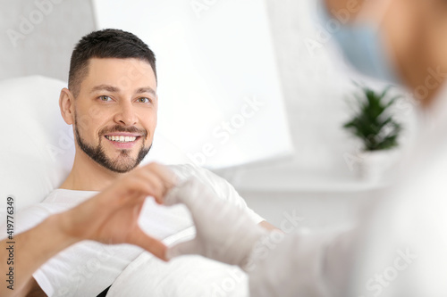 Cardiologist and patient ma...