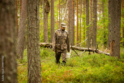 a man in a pine forest, selective focus