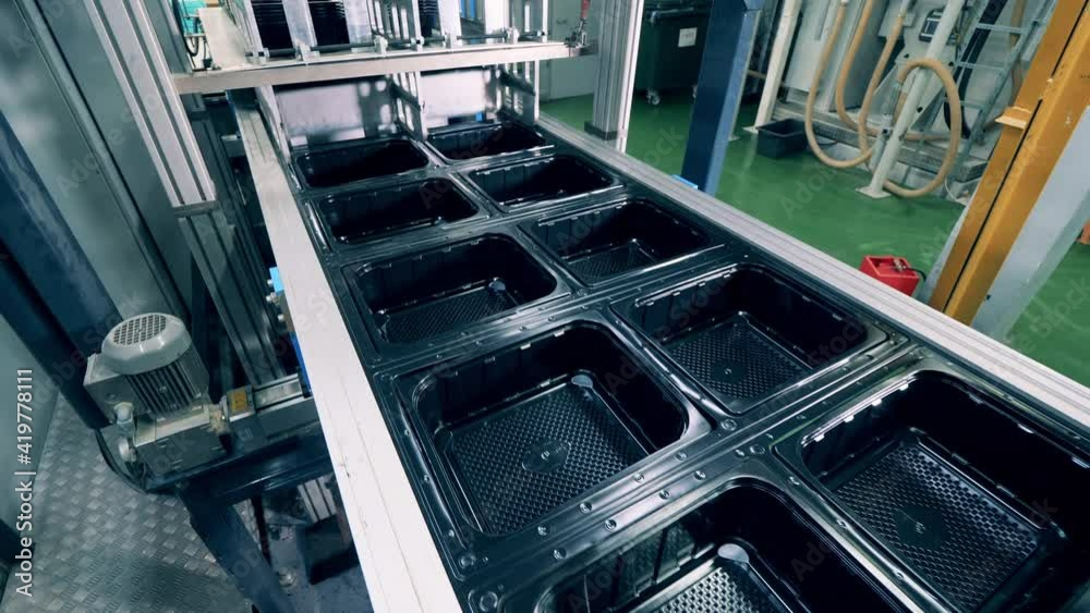 Top view of a plastic container production line