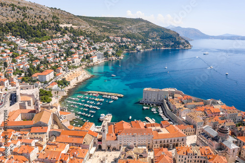 Aerial drone shot of Old Port in Dubrovnik old town in Croatia summer morning