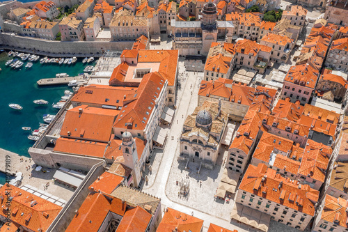 Aerial drone shot of St. Blaise Church in luzar square Stradun street in Dubrovnik old town in Croatia summer