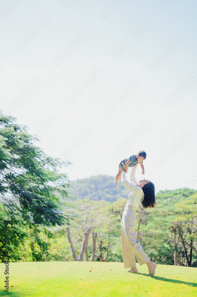 Mother And Baby outdoors. Nature.Portrait of happy loving mother Mother And Baby outdoors. Nature.Portrait of happy loving mother