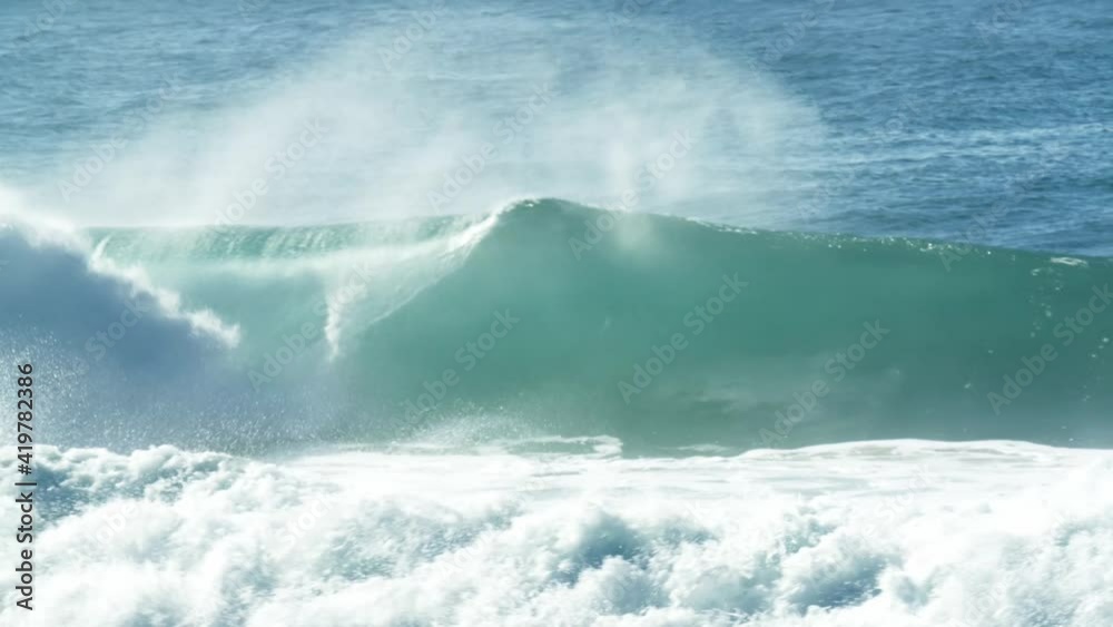Aerial view of huge waves rolling over the sea in Sagres, Portugal Aerial view of huge waves rolling over the sea in Sagres, Portugal