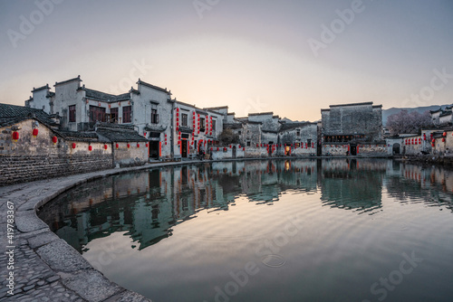 Sunset view of the ancient Chinese architecture in Hongcun village, Anhui province. photo