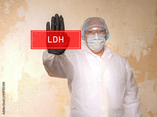 Healthcare concept meaning LDH Lactic Acid Dehydrogenase with sign on the piece of paper. photo