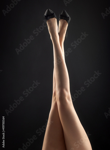 Woman sexy slim legs. Office style. Seductive girl foot.