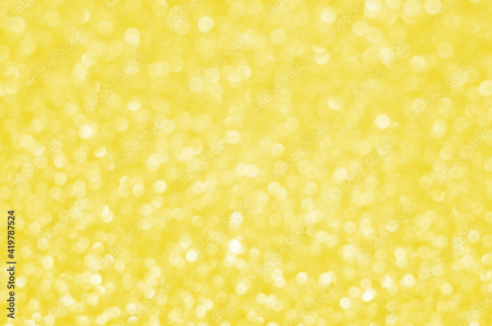 Illuminating Pantone Color Of The Year 2021. Abstract festive bokeh background with shining defocus sparkles. Blurred glitters shimmering dust macro close up, copy space for text logo Illuminating Pantone Color Of The Year 2021. Abstract festive bokeh background with shining defocus sparkles. Blurred glitters shimmering dust macro close up, copy space for text logo