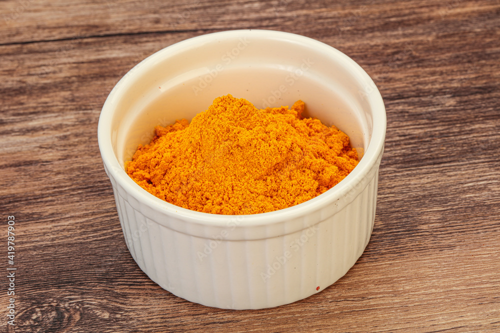 Tumeric powder in the bowl Tumeric powder in the bowl