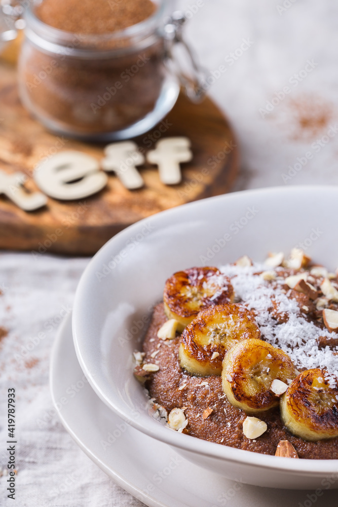 Teff grain porridge with banana topping for breakfast Teff grain porridge with banana topping for breakfast