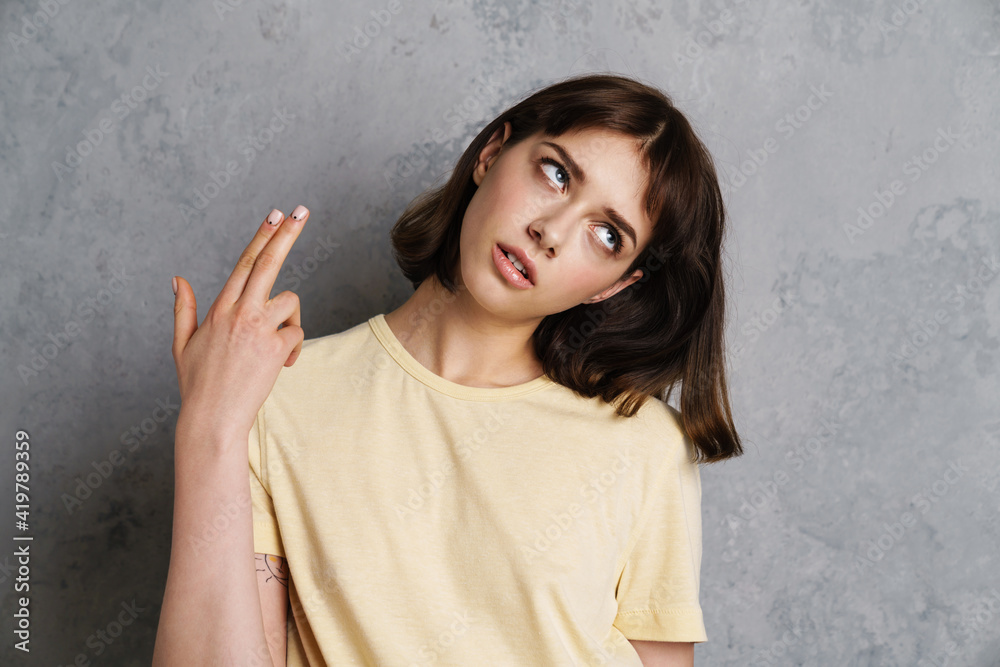 Portrait of upset tired of life woman holding fingers Portrait of upset tired of life woman holding fingers