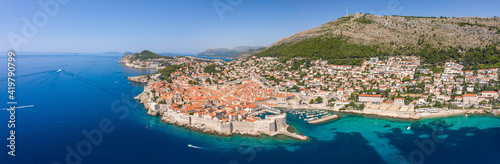 Aerial panorama drone shot of Old Port in Dubrovnik old town by Adriatic sea in Croatia summer noon