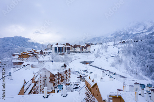 Winter aerial view of the Ski Resort Rosa Khutor. A complex of hotels on the site of the former Olympic village of Rosa Plateau at an altitude of 1170 m from sea level. Krasnaya Polyana, Sochi, Russia