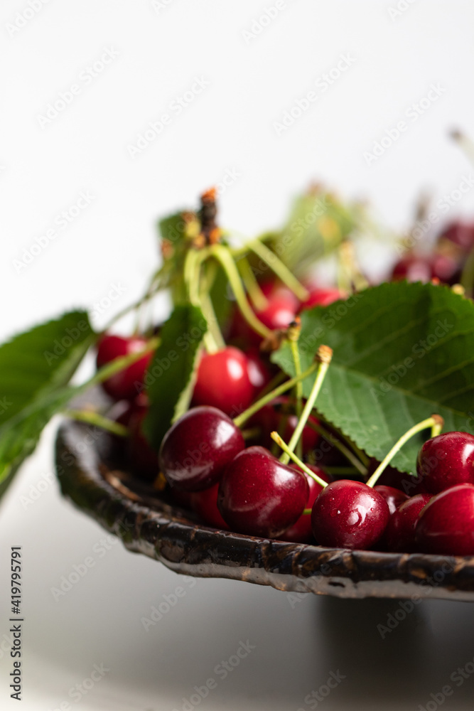 Sweet Ripe Cherries in the Bowl. Prunus avium. Treat of the Nature Sweet Ripe Cherries in the Bowl. Prunus avium. Treat of the Nature