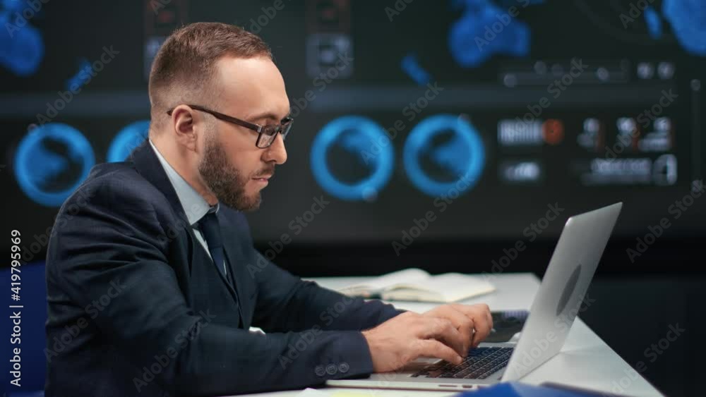 Focused business male working laptop use trade finance application. 4k Dragon RED camera