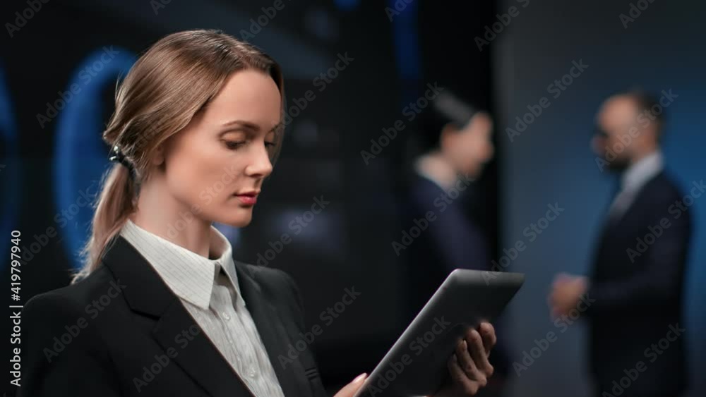 Businesswoman use tablet pc at modern holographic finance profit diagram. 4k Dragon RED camera Businesswoman use tablet pc at modern holographic finance profit diagram. 4k Dragon RED camera