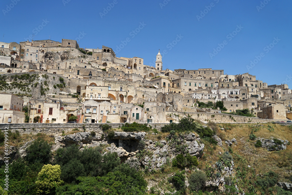 Sassi di Matera historic site aerial panoramic cityscape with ancient cave dwellings, popular tourist travel landmark, guided tour concept, Basilicata, Italy