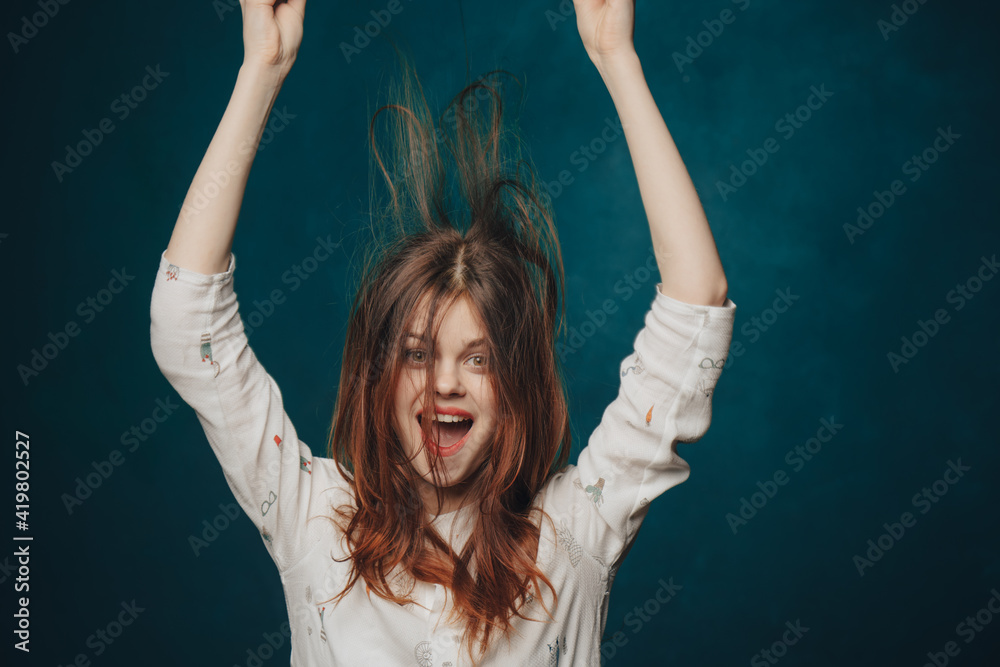 energetic woman with hat over head on blue background and shirt model emotions energetic woman with hat over head on blue background and shirt model emotions