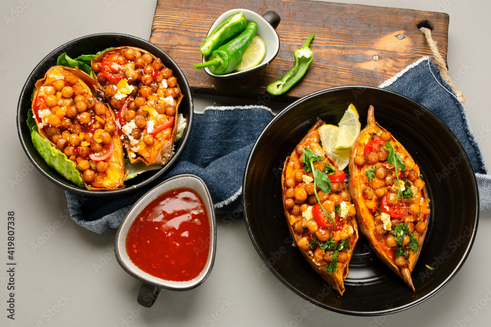 Stuffed sweet potato with spiced chickpea, dressing and herbs. Stuffed sweet potato with spiced chickpea, dressing and herbs.