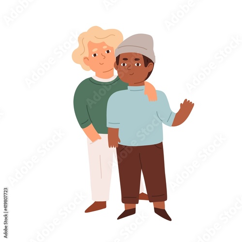 Portrait of little boys. Couple of happy multiracial friends standing and hug...