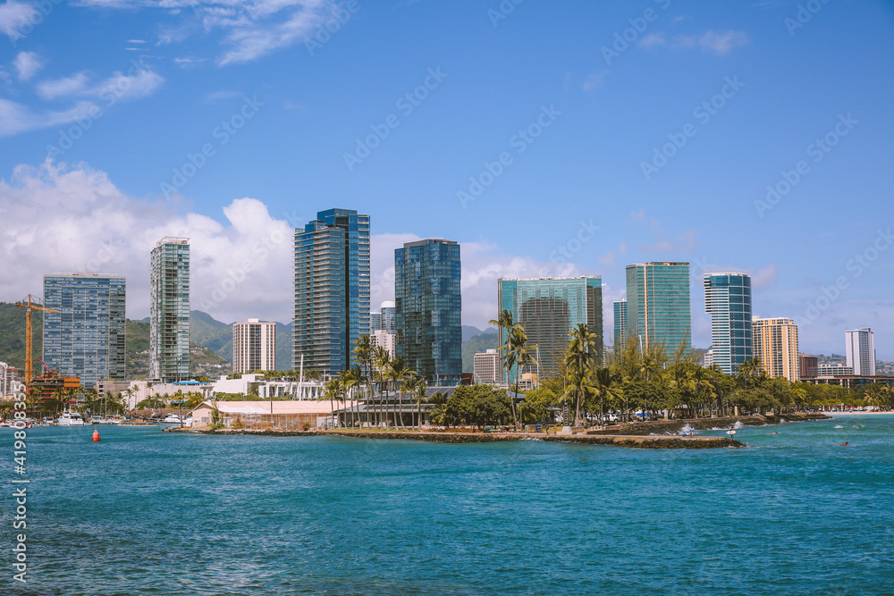 Coastal city view at Kakaako Waterfront Park, Honolulu, Oahu, Hawaii.   Ward Centre . Ward Village. Kewalo Basin Park. Luxury apartments by the sea