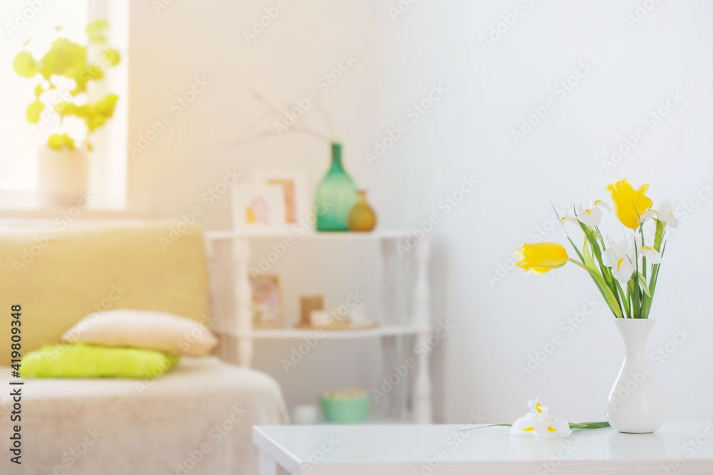 Obraz premium white home interior with spring flowers and decorations