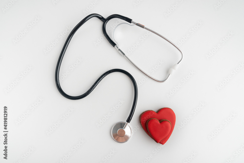 Stethoscope and two red hearts on white background. Health concept. Heart transplant.