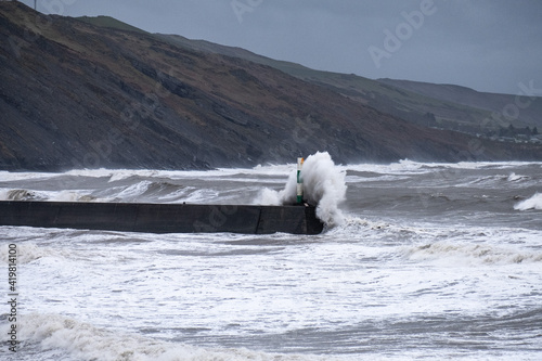 Gale force winds and high tide produce massive waves that crash into the seafront in Aberystwyth.