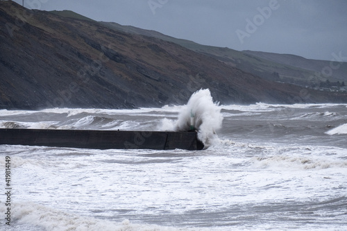Gale force winds and high tide produce massive waves that crash into the seafront in Aberystwyth.