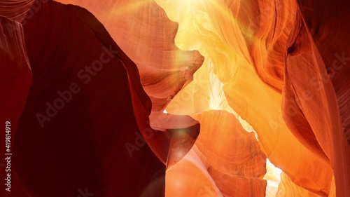 Red and orange walls of Antelope Canyon in Arizona, USA, United States. Zoom out shot of Antelope Canyon with rays of the midday sun and glare