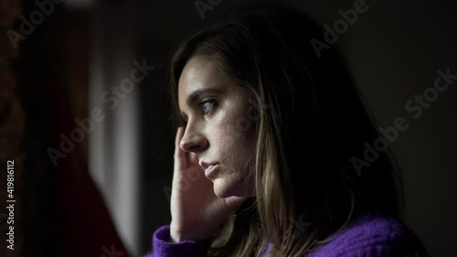 Wallpaper Mural Anxious concerned woman standing by window looking outdoors thinking Torontodigital.ca