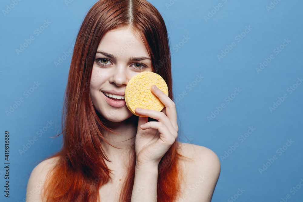 cheerful red-haired woman naked shoulders clear skin sponge near face cheerful red-haired woman naked shoulders clear skin sponge near face