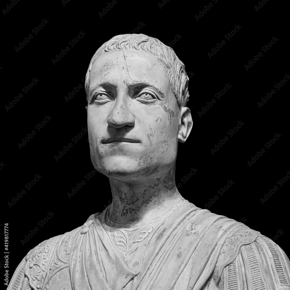 Head detail of the ancient man sculpture. Stone face isolated on black background. Antique marble statue of mythical character Head detail of the ancient man sculpture. Stone face isolated on black background. Antique marble statue of mythical character