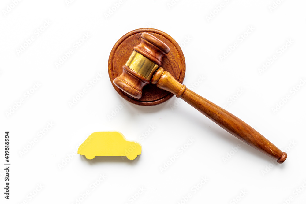 Car shape with judge gavel. Driving and insurance law concept Car shape with judge gavel. Driving and insurance law concept