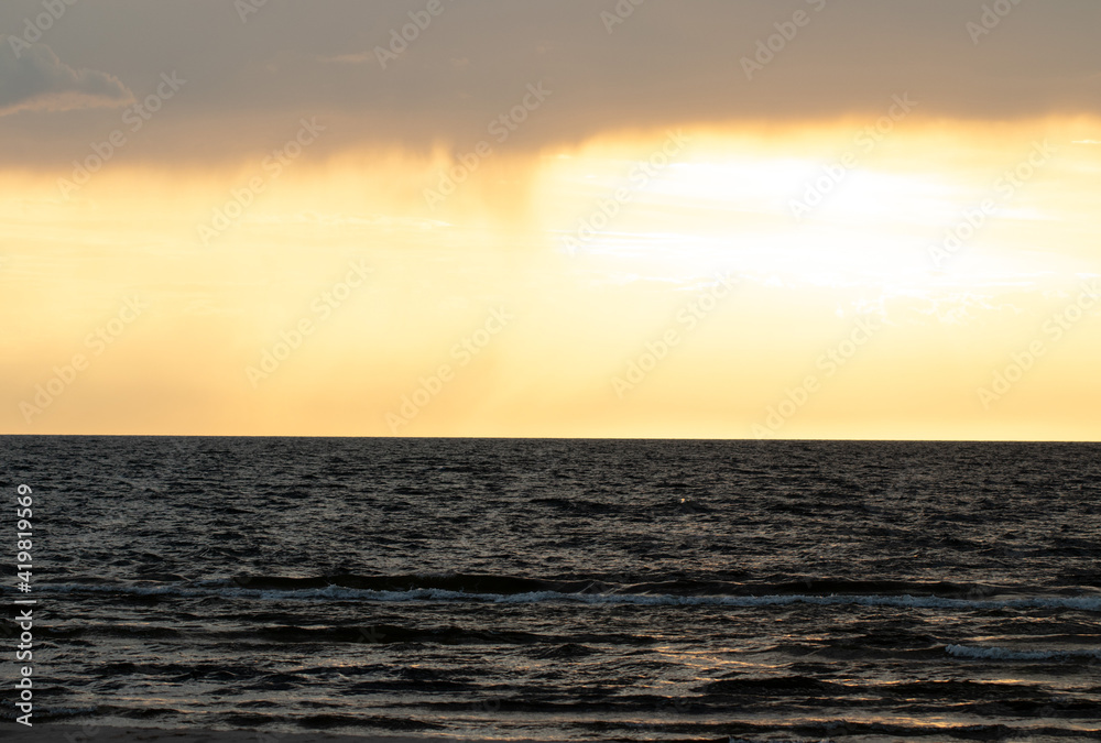 Fototapeta premium Sunset views in Latvia. Calm and beautiful Baltic sea at sunset