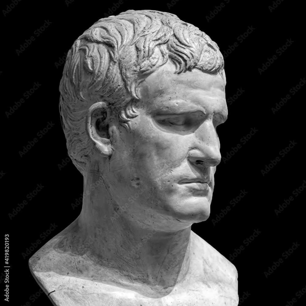 Head detail of the ancient man sculpture. Stone face isolated on black background. Antique marble statue of mythical character Head detail of the ancient man sculpture. Stone face isolated on black background. Antique marble statue of mythical character