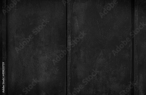 Texture of old rusty grungy metal sheet. Uneven aged rough bumpy surface. Corrugated painted wall of smudged iron. Rusted hard pitted retro garage door. Vintage dirty destroyed roof for grunge design