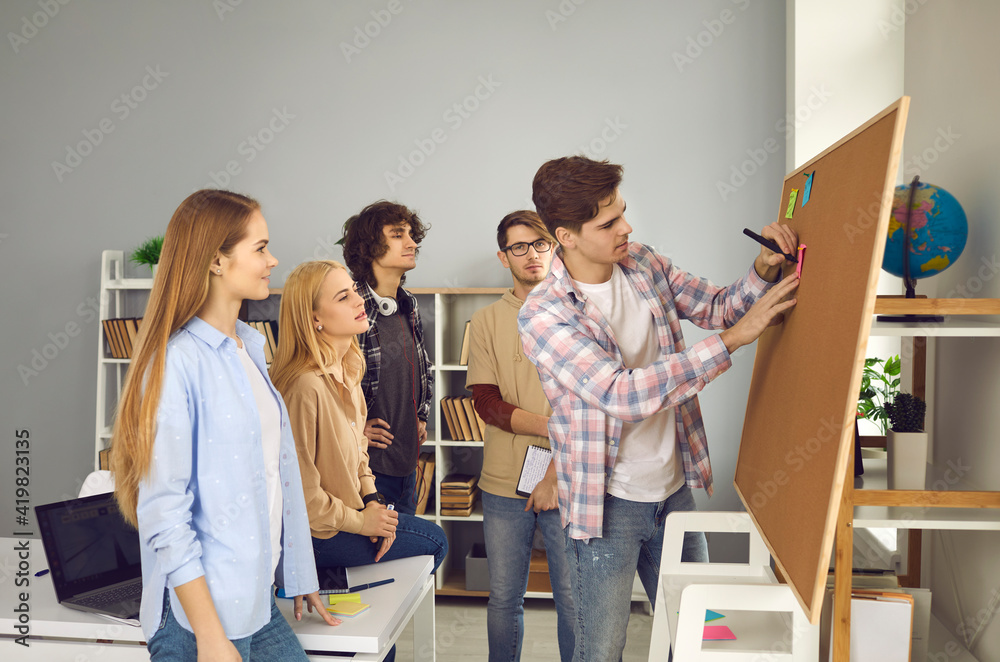Teamwork and creativity. College or university friends meeting in ...