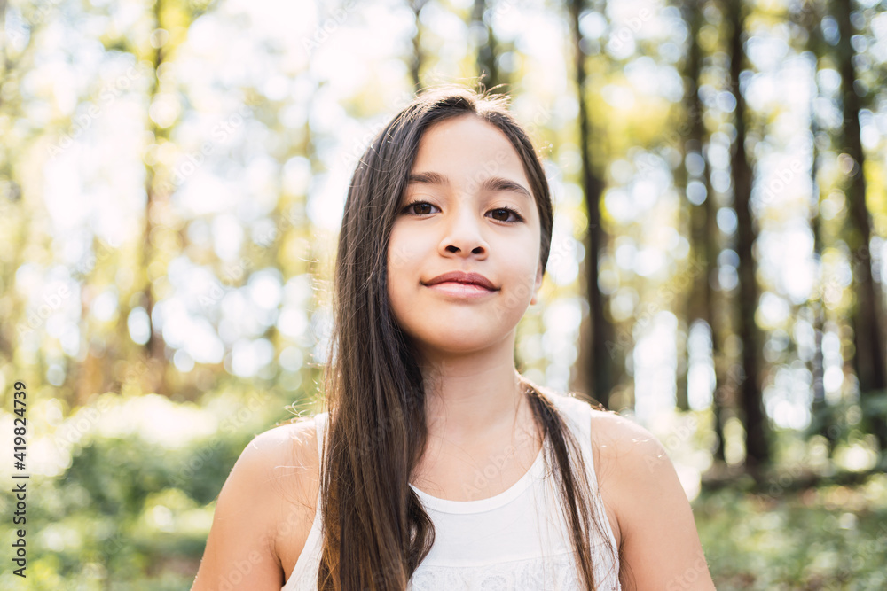 Portrait of a little girl with long hair in the open air. Portrait of a little girl with long hair in the open air.