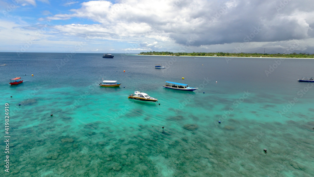 Multicolored boats in the distance on the gili trawangan island