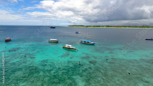 Multicolored boats in the distance on the gili trawangan island