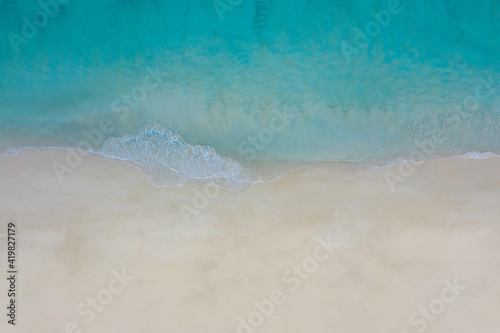 Aerial top view of beach with sandy sea landscape with turquoise water background