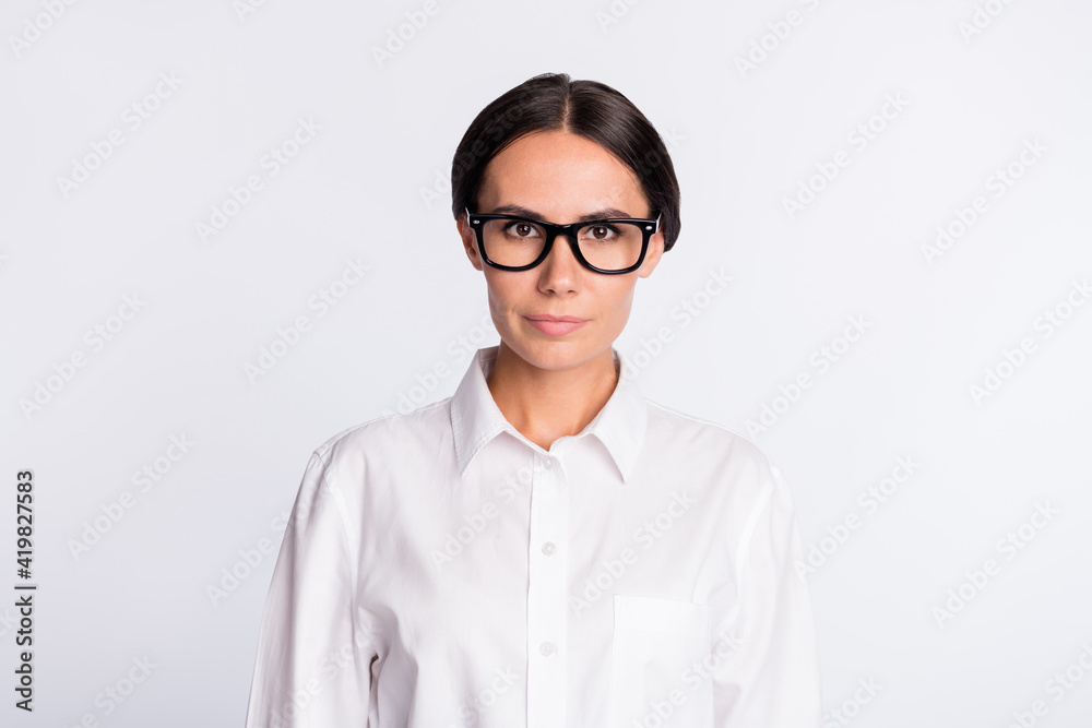 Photo of optimistic brunette hairdo lady wear spectacles white shirt isolated on grey color background