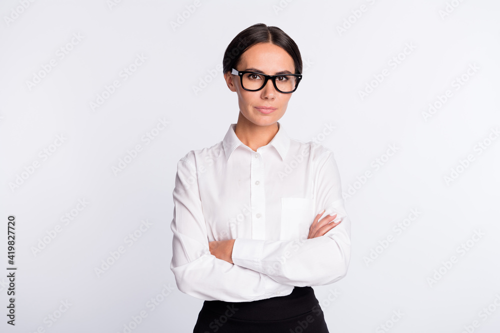 Photo of optimistic brunette hairdo lady crossed arms wear spectacles white shirt isolated on grey color background Photo of optimistic brunette hairdo lady crossed arms wear spectacles white shirt isolated on grey color background