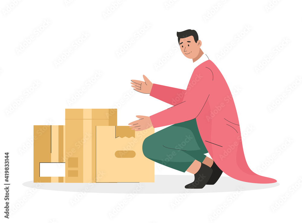 Man holding cardboard box with things. Young guy packing belongings in many boxes Man holding cardboard box with things. Young guy packing belongings in many boxes