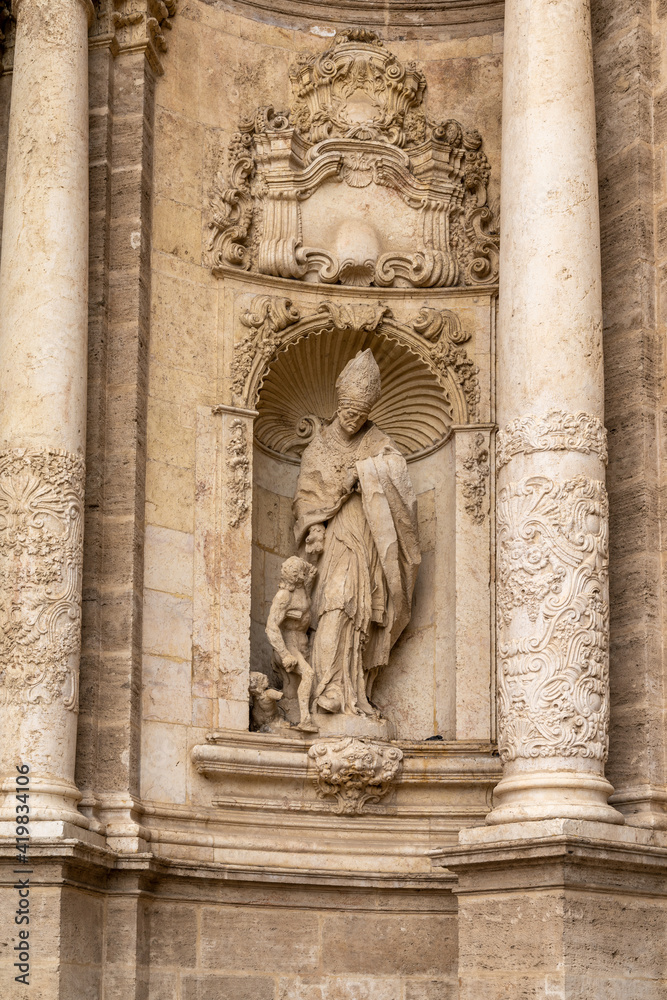 architectural detail of the stone sculptures at the entrance of the cathedral of Valencia